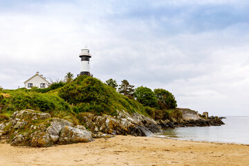 Lighthouse on Inishowen peninsula in North Ireland. Beautiful Wild Atlantic Way with typical irish landscapes, coastline and cliffs.