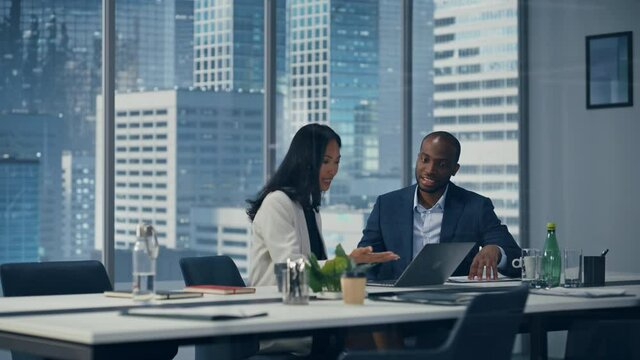 Businesspeople in Modern Office: Business Meeting of Two Businessmen Talking. Strategy Meeting of CEO and Director Brainstorming Business Idea of e-Commerce Software Investment