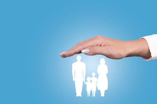 Family life insurance, family services and family support concepts. Woman's hand with protective gesture over family icon. Copy space.