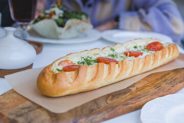 cream sauce, tomatoes and shrimps, stuffed baguette