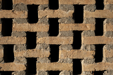 brown bricks background with gaps forming wall