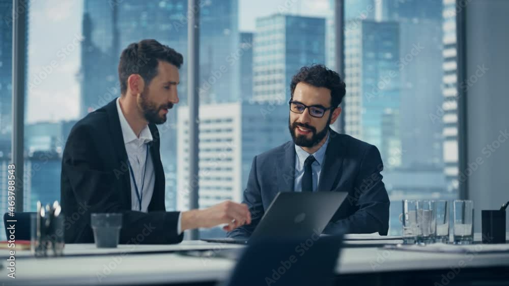 Poster businesspeople in office: business meeting of two businessmen using laptop computer and talking. tec