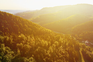 Mountain background. Beautiful sunrise over forest mountains range. Nature landscape