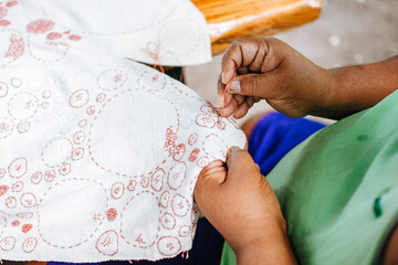 Man's hands sewing beautiful fabric. Traditional embroidery, learning, teaching ,how to do, hand craft, hobby, embroidery stitch concept.