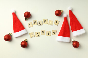 Secret Santa and Christmas composition on white background