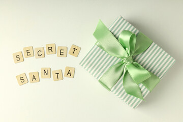 Secret Santa and Christmas composition on white background