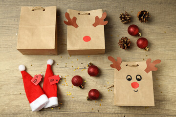 Christmas accessories on wooden background, top view
