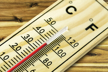 Thermometer Fahrenheit 100 close up on wooden background