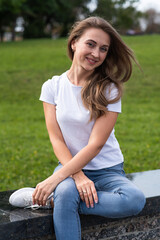 Obraz premium Portrait of a young, happy and attractive blonde Caucasian girl.
