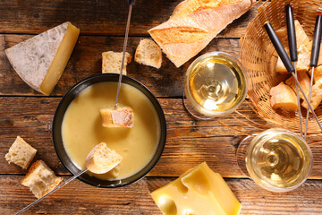 cheese fondue with baguette and wine