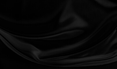 Black gray satin dark fabric texture luxurious shiny that is abstract silk cloth background with patterns soft waves blur beautiful.