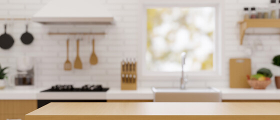 Modern wooden counter top for montage with set of seasoning shakers over blurred modern kitchen background.