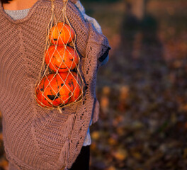 woman holding a halloween pumpkins outdoor