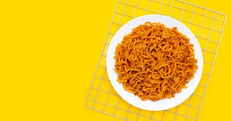 Pickle Turnip in white plate on yellow background.