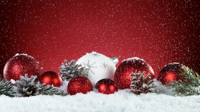 Super slow motion of falling snow with christmas glass balls. Filmed on high speed cinema camera, 1000 fps.