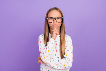 Photo of minded thoughtful small lady finger chin think wear specs dotted nightwear isolated purple color background