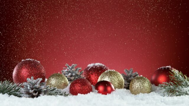 Super slow motion of falling snow with christmas glass balls. Filmed on high speed cinema camera, 1000 fps.