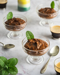 Carob mousse served on bowls with espresso