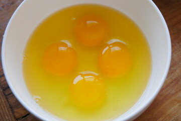 Beat 4 egg yolks in a bowl
