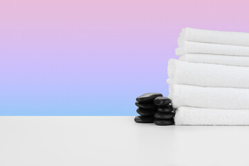 Spa still life with stacked towels and spa stone