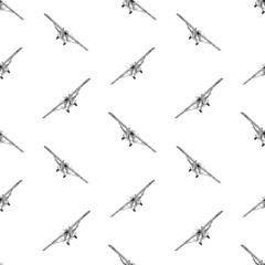 Seamless pattern from sketches of vintage light airplane in flight