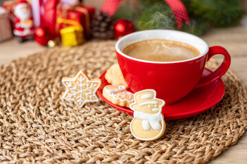 Merry Christmas with homemade cookies and coffee cup on wood table background. Xmas eve, party, holiday and happy New Year concept