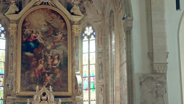 The church of Santi Quirico and Giulitta. The main altar is the altarpiece with the Madonna appearing to Saints Quirico and Giulitta. Termeno, Bolzano
