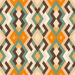 Abstract seamless pattern. Vector geometric background of triangles in green and yellow colors. Mosaic texture for textile, clown, carpeting, warp, book cover, clothes