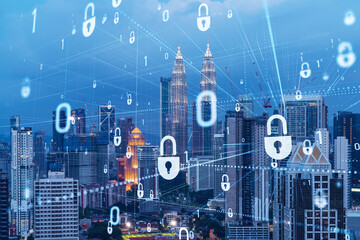 Glowing padlock hologram, night panoramic city view of Kuala Lumpur, Malaysia, Asia. The concept of cyber security shields to protect KL companies. Double exposure.