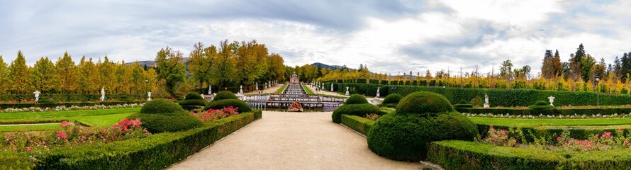 Royal Palace of La Granja de San Ildefonso. Panoramic the Royal Palace of La Granja de San Ildefonso. Gardens and fountains throughout the enclosure full of flowers and colorful leaves in the fall.