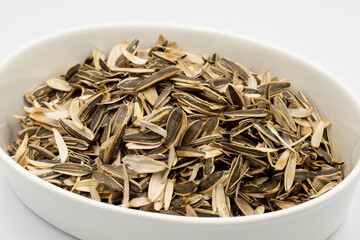 sunflower seed husks on a white background. sunflower seed litter