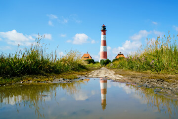 Lighthouse Westerhever in Schleswig Holstein, Germany. View on landscape by national park...