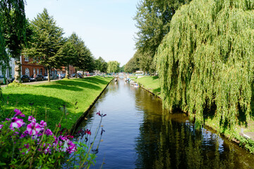 Fototapeta premium View and details of Friedrichstadt, a town in the district of Nordfriesland, in Schleswig Holstein, Germany. It was founded in 1621 by Dutch settlers