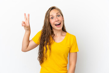 Young caucasian woman isolated on white background smiling and showing victory sign