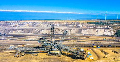 A huge bucket-wheel excavator digging coal on the open-pit mine. Garzweiler open cast mine,...