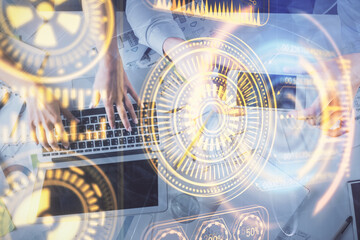 Fototapeta premium Double exposure of man and woman working together and technology theme drawing. Computer background. Top View. High tech concept.