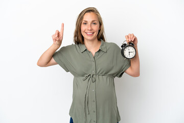 Obraz premium Young caucasian woman isolated on white background pregnant and holding clock while counting one