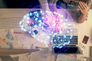 Double exposure of man and woman working together and human brain hologram drawing. Brainstorm...