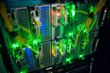 Closeup of computer server with colorful lights and wires