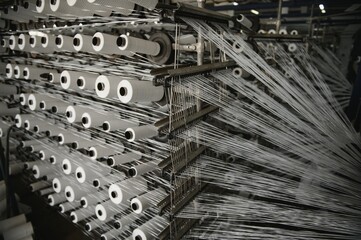 Industrial fabric production line. Weaving looms at a textile factory