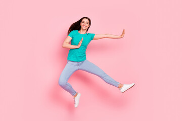 Fototapeta na wymiar Full body photo of young woman happy positive smile jump up have fun ninja isolated over pastel color background