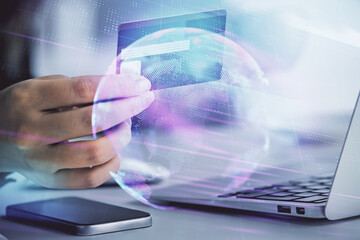 Multi exposure of woman on-line shopping holding a credit card and tech theme drawing. Technology concept.