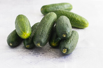 a few cucumbers on a white tablecloth