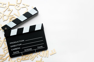 Film slate movie cut scence on wood text and clear background.For Film editing go viral by vdo...