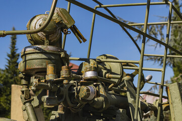 Military equipment of the Second World War. Details of the Soviet anti-aircraft gun in the park on a sunny day.