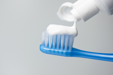 Fototapeta na wymiar Toothbrush and toothpaste on white background