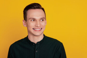 Fototapeta premium Photo of young attractive business man happy positive smile wondered look empty space isolated over yellow color background