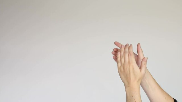 Woman, person hands arms clapping applause bravo showing two ok okay gesture isolated over white background in studio. Copy space for advertisement. With place for text or image Advertising area mock 