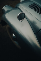 Car front bumper detail with mirror. Old vintage car front detail.