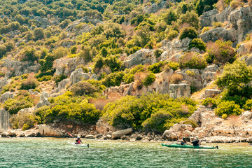 View of the northern side of the island of Kekova where the ruins of the partially flooded ancient cities of Dolichiste, Aperlaia, Teimussa and Simena are located. Turkey. Boat trip